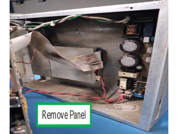 Gently open the back panel so that able to disconnect the floppy and power cables as shown.
