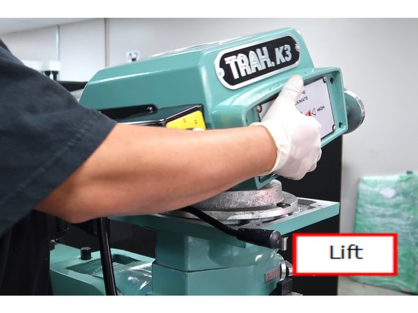 Lift upper head cover from machine.