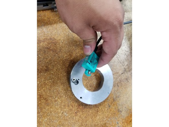 Install the new Encoder to the Plate and tighten the mounting screws securely.