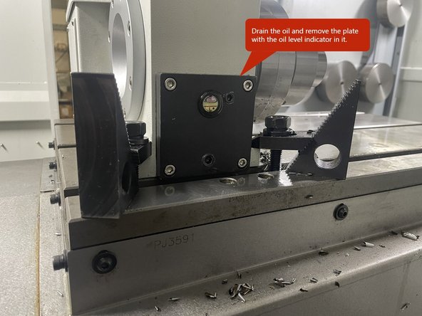 To adjust the backlash on the VMC2 4th Axis you need to drain the oil and remove the black plate with the oil level indicator in it.