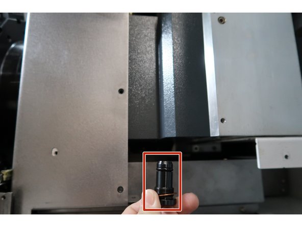 Beneath this plug, there is a 5mm hex screw that, when loosened, will allow the turret to move.