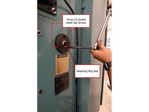 Using an 8 MM Hex Socket, tighten the three socket head cap screws that secure the counterweight-retaining plug into the column.
