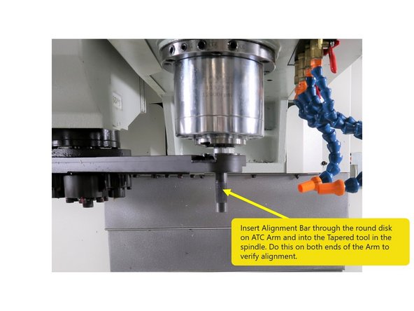 Continue tightening the M12 bolt until the arm reaches the proper height that allows it to have smooth engagement with the tool flange. Check for uniform gap on both sides of the flange.
