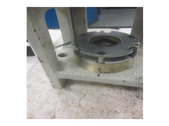 Lightly lubricate all fasteners and install the new brake onto the housing. Make sure the wire is in the correct location. Install and tighten the screws securely.