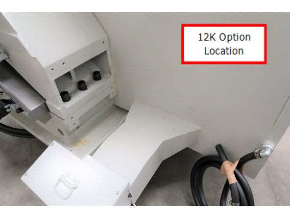 TMC left rear corner without the 12K Spindle Oil Cooler pump installed. Note that there are two sets of holes drilled and threaded in the casting for options to be installed.