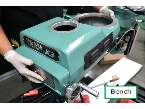 Set it on a workbench for further disassembly.