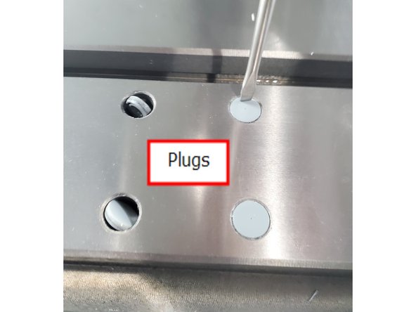 Carefully remove (16) counter bore plugs by lightly taping the edge of plug. The plugs will rotate in counter bore, remove with needle nose pliers. Save plugs to re-install.
