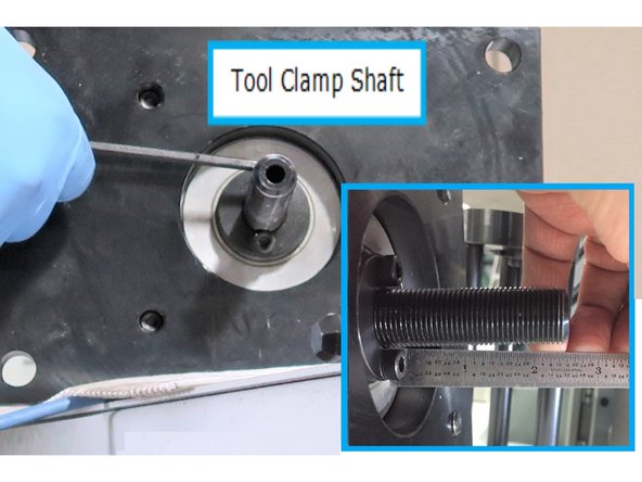 Install clamp shaft (with left hand threads) into tool clamp cylinder and base. Set the distance to the shaft by turning the shaft, until 2 1/2" are exposed from the flange to the end of the shaft.