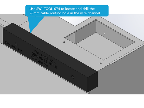 With SWI-TOOL-074 mark and drill the location of the hole in the wire way for the side door motor cables. Once the hole is marked and drilled use a Greenlee Punch or similar tool to open the hole to 28mm in diameter. Once you have made the hole install grommet 26779-5. See Image 3.