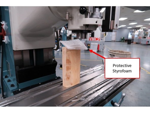 Once the installation of the counterweight support is complete, make sure that the head is directly above the center of the worktable, and that the measurement for the placement of the head within the X-Axis is at equal distance on both sides.