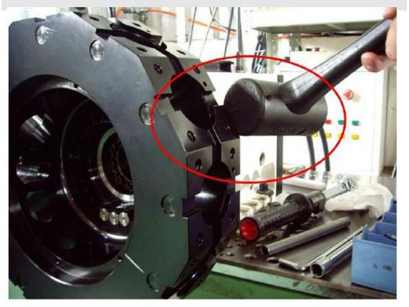Verify the turret is being supported by the lifting device and then tap the turret disk off of the turret with a plastic tipped or dead blow hammer.