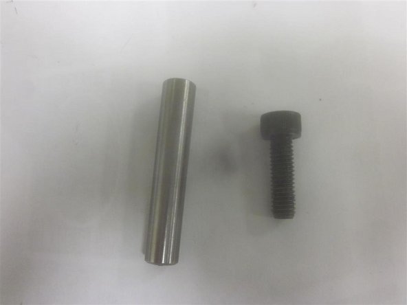 Slide the Y-Axis cover fore and aft to gain access to the bridge mounting screws.