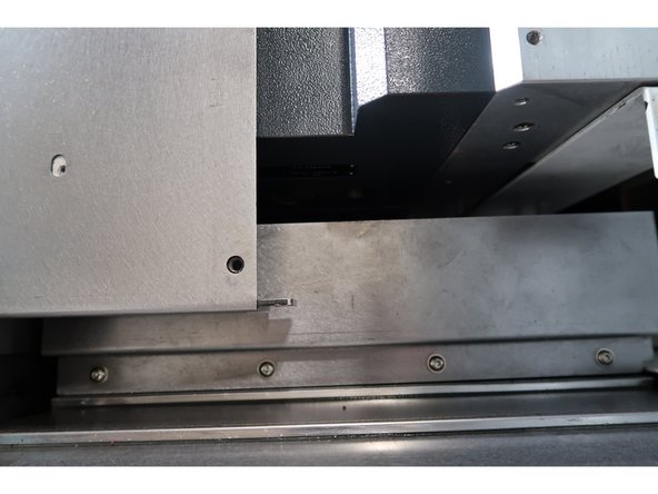 There is a black, threaded plug on the underside that can be removed using a 6mm hex key.