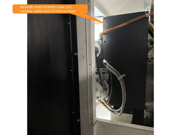 Reinstall motor bracket cover to motor bracket and reattach cables and oil lines to the cover as seen in Photo 3.