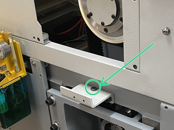 Using the push pull motor adjuster, tighten the screw to adjust the motor up to loosen the drive belts and then remove them.