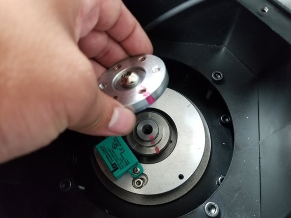 Place the plastic shim between the magnetic pick up ring and the Encoder. Set the clearance so the shim has a slight drag and can hold itself up without falling over.