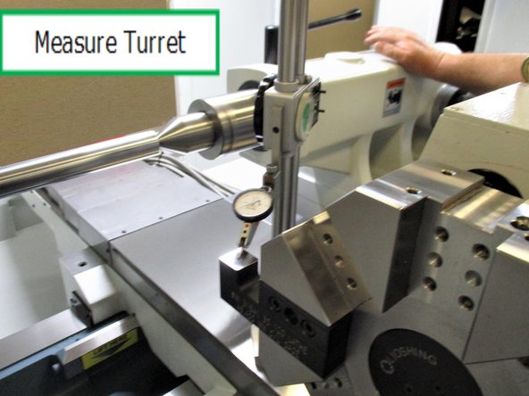 Carefully slide over the dial indicator to measure the height of the turret.
