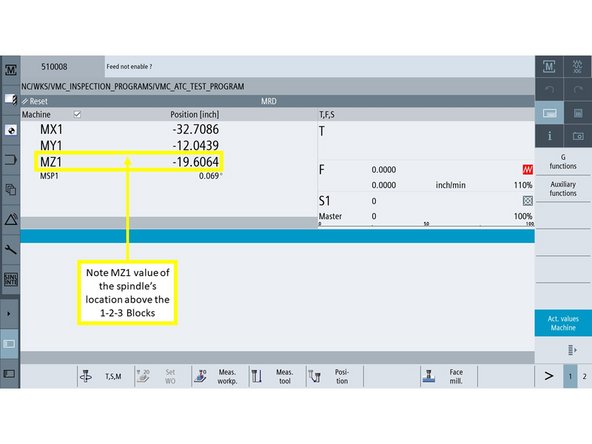 Jog the spindle down until it just blocks the stacked blocks from sliding underneath.