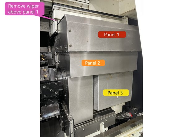 Remove the wiper above Panel 1. See Photo 2