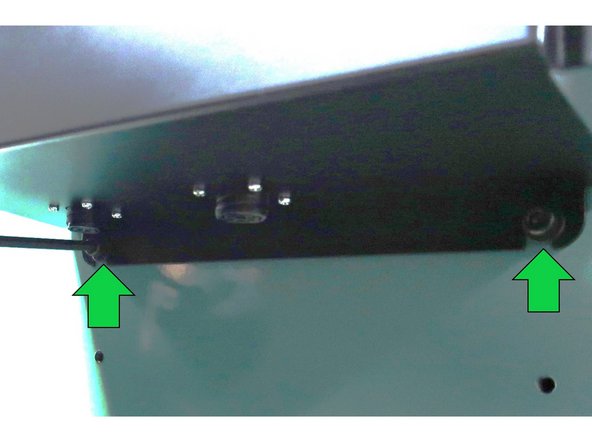 Disconnect any cables on the left side of electric box. Loosen the two screws on the bottom of the box.