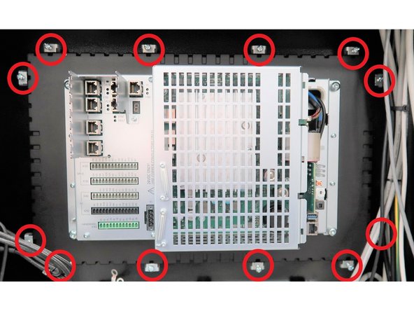 Secure the pendant to prevent it from falling. Loosen the twelve screws on the clamps securing the PPU to the pendant frame. Remove the clamps and carefully lift out the original PPU.