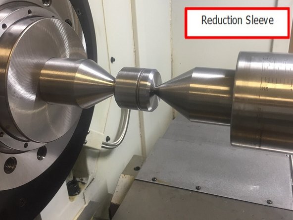 Remove the (9X) M20 SHCS and washer that attach the spindle puller assembly to the spindle and move the Z axis back away from the spindle. Remove the spindle puller assembly from the X axis carriage. Reinstall 6 socket head cap screws in front spindle cover and tighten.