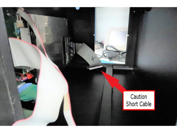 Caution: Disassembly of the pendant requires sliding out the internal chassis. You must use caution when sliding out the chassis because of four wired connections from the chassis to the front of the case. This internal view shows a short cable on the left side of the face plate.