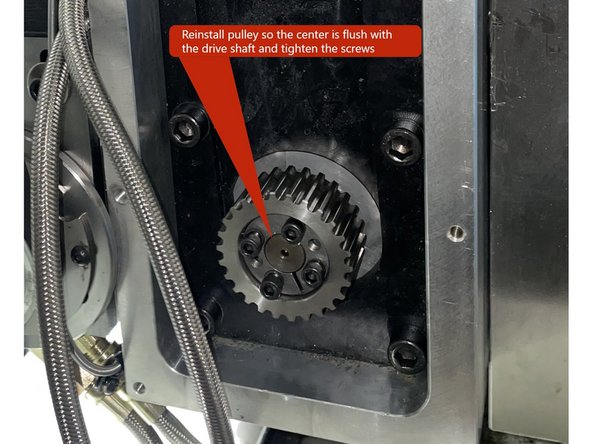 Reinstall the pulley to the gearhead drive extension so that the center is flush with the drive shaft and tighten the taper lock screws.