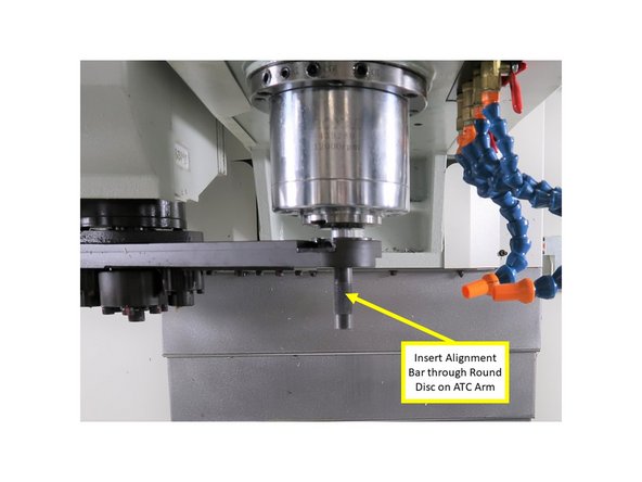 Continue tightening the M12 bolt until the arm reaches the proper height that allows it to have smooth engagement with the tool flange. Check for uniform gap on both sides of the flange.