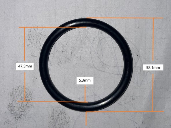 Align one of the 3 alignment holes with the drive button on the spindle and push the collet chuck onto the chuck adapter on the draw tube.