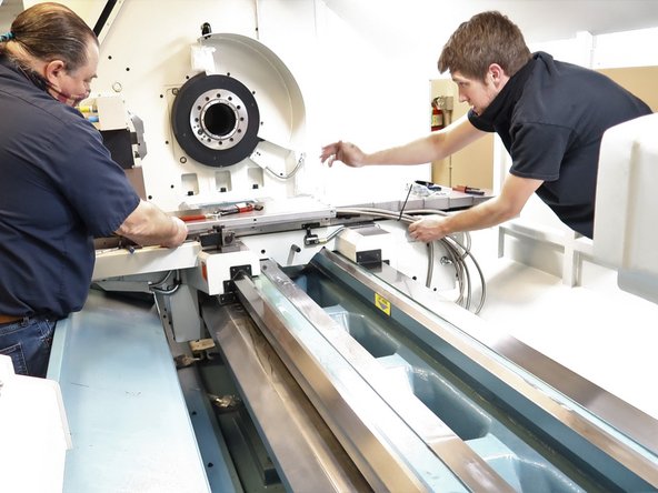 Route the hoses near the table in the lower cross slide.  The five hoses and one electric line will fit in the cross slide with the top bolted in place.  Use rubber hose clamps to control the hoses from the cable carrier up to the table.