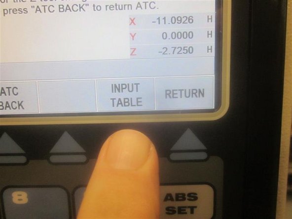 Go to service code 520, and bring the ATC forward (towards the operator). Press the &quot;Input Table&quot; key. Use the hand wheel to highlight a tool location. Using a co-axial indicator and tool holder, check a couple of tool locations noting if the X and Y numbers coordinate with the location with the new ball screw.