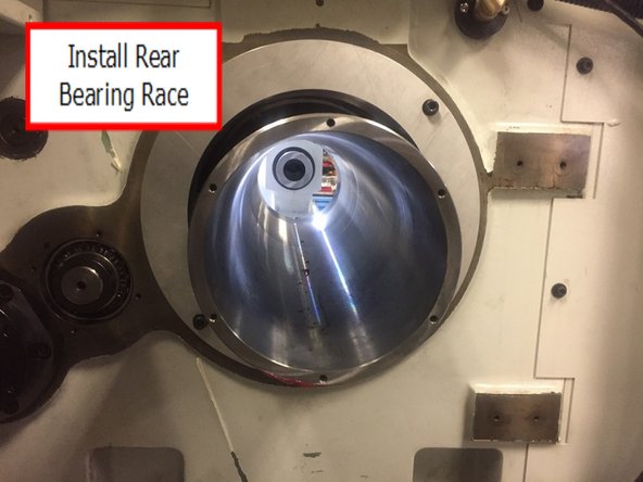 Verify the rear bearing race bore is clean and free of debris, lightly stone any nicks or high spots