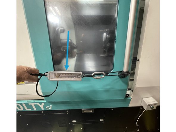 To measure the force to open and close the door we use a Fish Scale attached to the door.