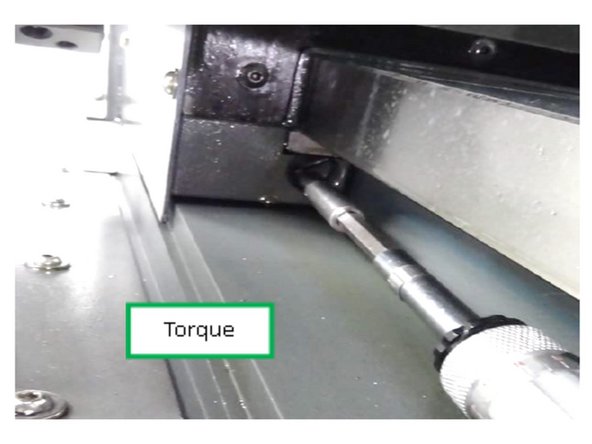 Locate the gib adjustment screws on the opposite side of the carriage.