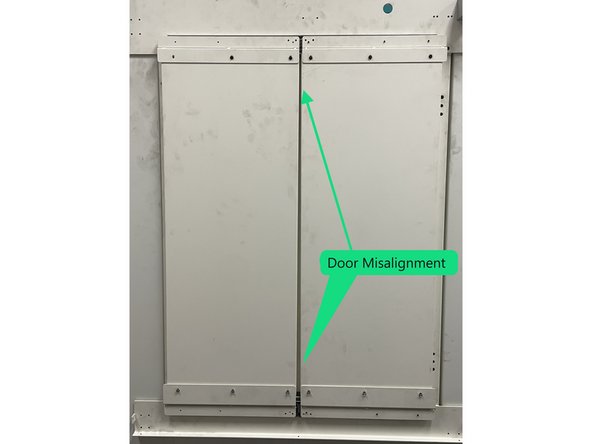 If there is some binding or roughness in the movement of the doors check where they go over the lip in the upper rail mounting plate. You may need to adjust the doors up or down to center them over the lip. Check both sides of both doors. Adjust as needed. See Photo 1
