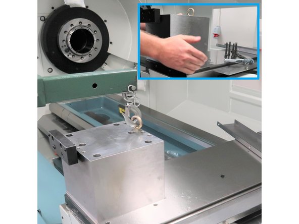 Cleaning fine burrs around the holes to verify a smooth surface on all sides of the base.