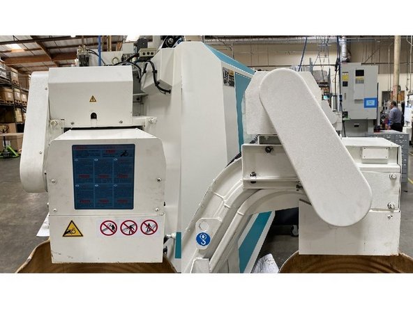 Reinstall all the remaining sheet metal covers that were removed, reinstall the coolant tank and reconnect to machine. Verify operation and return to production.