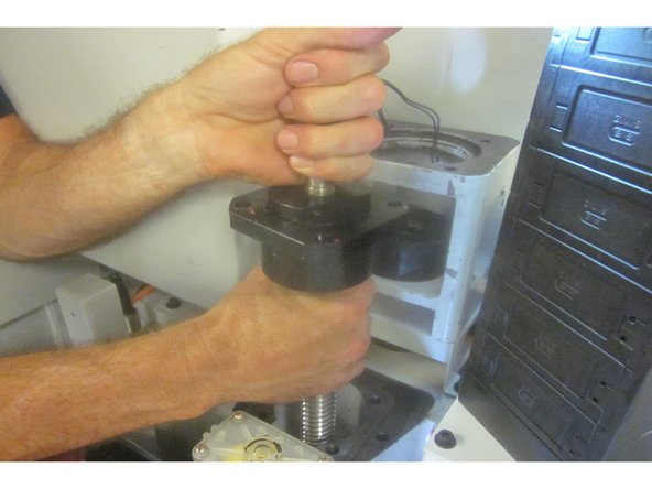 Disconnect the wire to the Z axis brake. Remove three (3) bolts attaching the brake housing to the column. Remove the housing and set it aside.