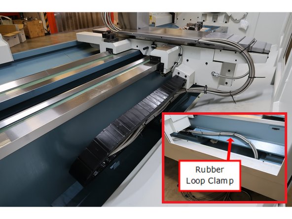 Cross slide cover top and bottom in place, hose clamps in place. and cable carrier organized to move back and forth with the table and keep hoses safe and tidy. Organize logic cable and hoses as shown using zip ties and removes ends.