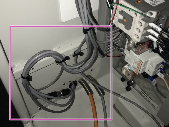 Once connections are made, dress cables neatly inside electrical cabinet as shown.