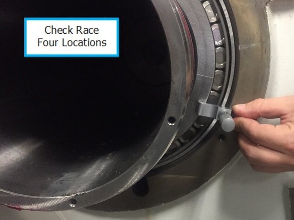 Measurement of the bearing race should be done prior to installing the tapered roller bearing not after as the pictures show.