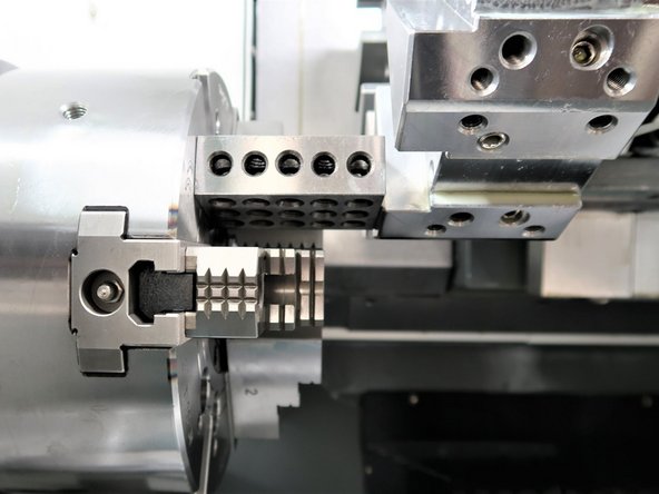 Remove any tool holder from the turret and clear the spindle face (remove any part or chuck jaws).