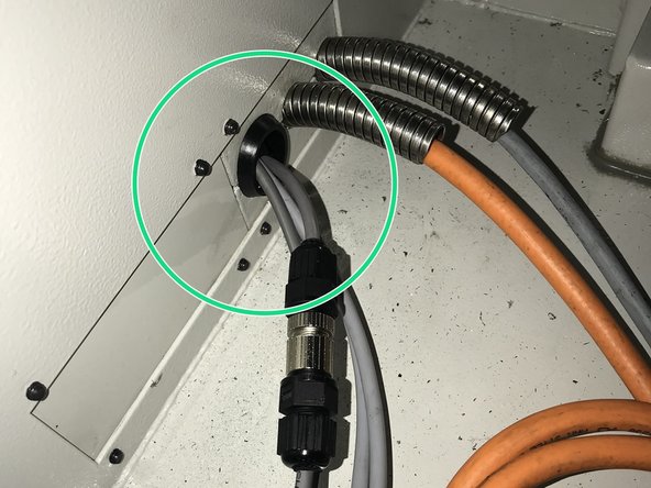 Route cables from Air Regulator Assembly into electrical cabinet as shown.