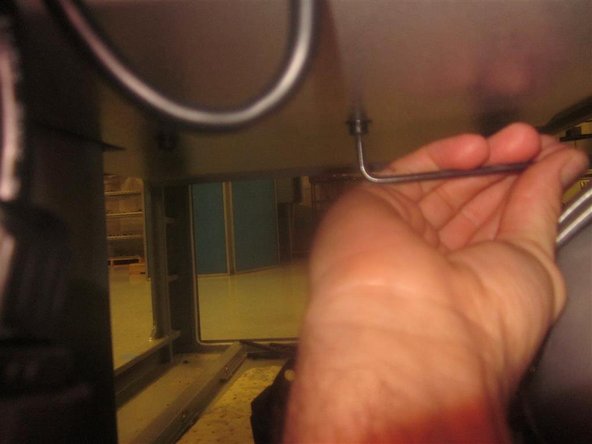 Before installing the work table wipers, break loose the wiper screws. After mounting the wipers, use a piece of paper to set the clearance between the wipers and the cover.