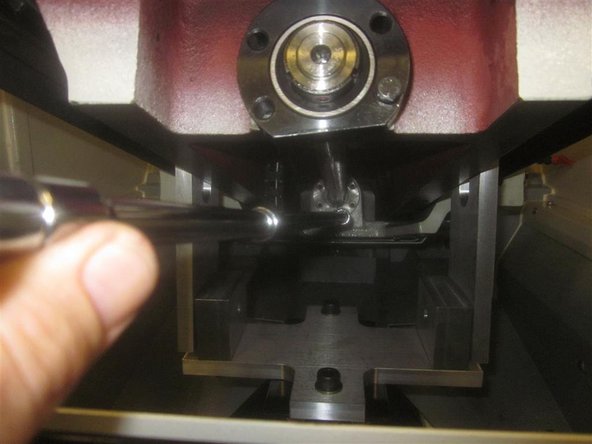Remove the five (5) 5mm SHCS that are attaching the ball nut to the yoke casting. You can perform this before raising the bridge. Push the work table rearward until it contacts the ATC; make sure that both pieces contact the long 8mm SHCS.