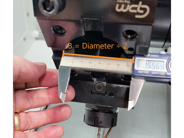 Insert a dial indicator into the spindle and align it with the front face of the bore.