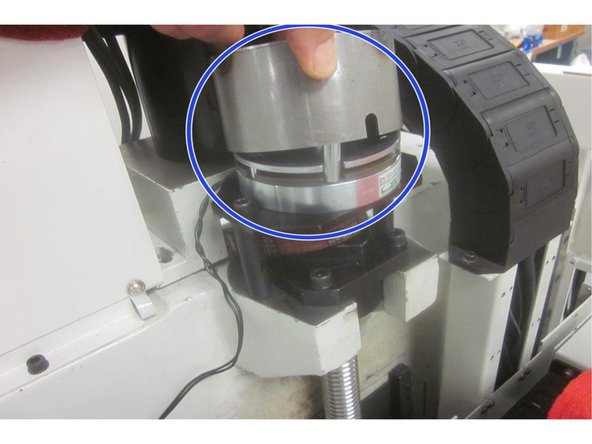 Remove the upper and middle rear sheet metal panels for access. Remove the four (4) motor mount screws and the small tension screw from the motor mount casting. Remove the belt from the motor pulley. Replace one motor mounting bolt and snug it up to prevent the motor from toppling over.