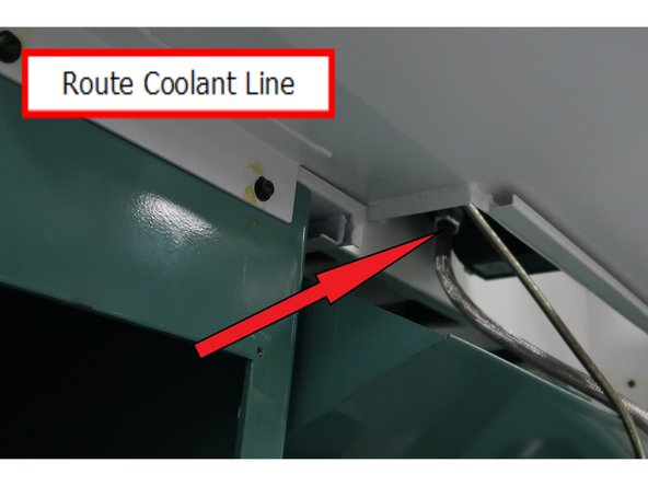 The coolant line comes out the coolant area and gets directly routed into the bottom of the work area.