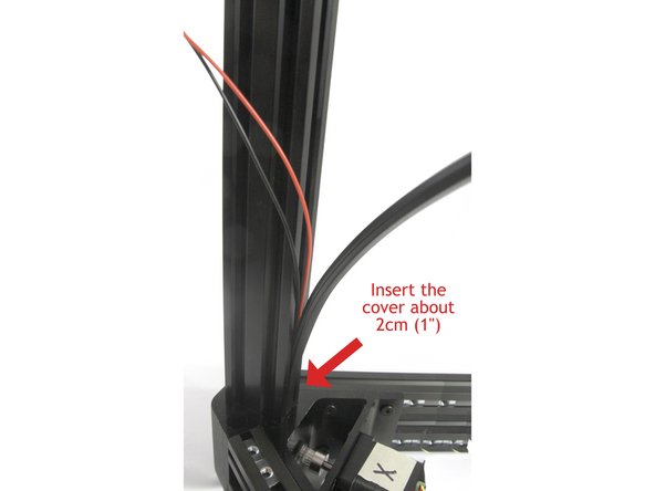 Insert one of the plastic T-slot covers you removed from the tower slots earlier. Slide the end about 2cms (1&quot;) into the corner extrusion.